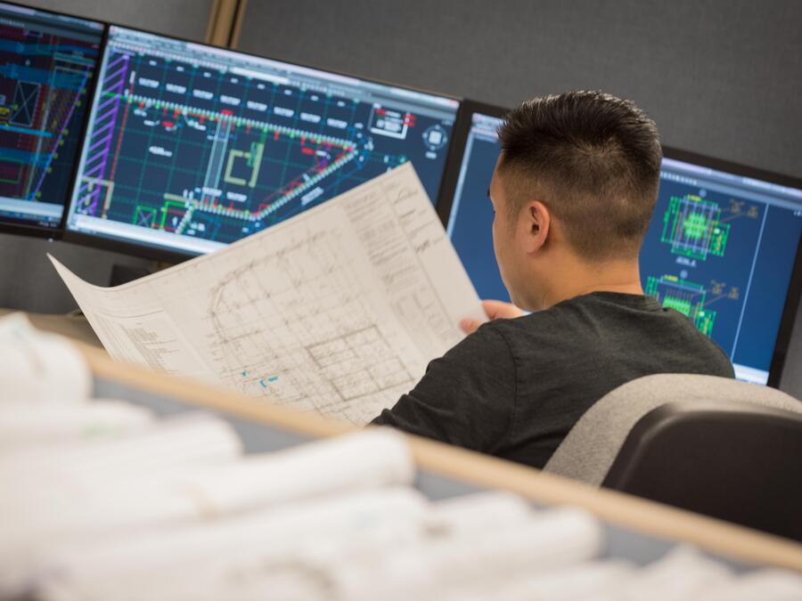 Engineer inspecting a drawing
